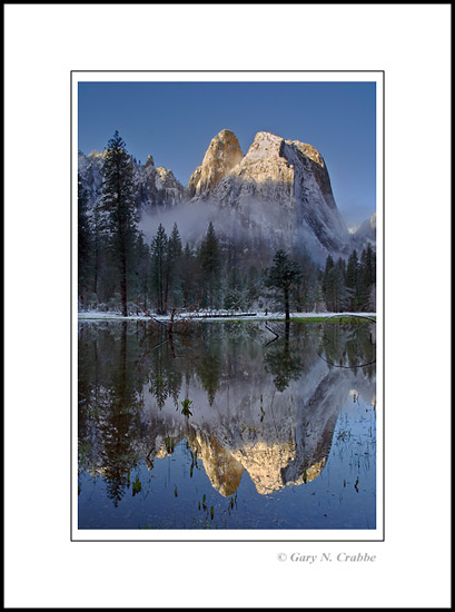 Picture: Snow-capped Cathedral Rocks in winter reflected in seasonal pond, Yosemite Valley, Yosemite National Park, California