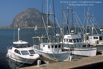 Commercial fishing boats at dock in front of Morro Rock, Morro Bay, Central Coast, California; Stock Photo photography picture image photograph fine art decor print wall mural gallery