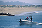 Sport fishing boat returning to harbor at Morro Bay, Central Coast, California