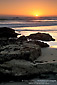 Sunset over the Pacific Ocean and coastal rocks, Morro Strand State Beach, Central Coast, California