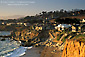 Coastal homes and cliffs at sunset on coastal shoreline at Cambria, Central Coast, California