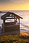 Couple watching the sunset over the Pacific Ocean from hut at Scripps Park, La Jolla, San Diego County Coast, California