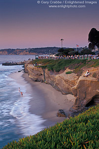 Evening light over ocean waves and sand beach at Scripps Park, La Jolla, San Diego County Coast, California
