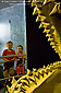 Kids pose in front of ancient giant dinosaur shark tooth jaws at SeaWorld, near San Diego, California