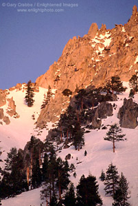 Sunrise light on peaks above Emerald Bay in winter, Lake Tahoe, California