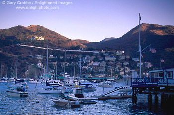 Picture: Sunset light on peaks above boats in Avalon Harbor, Avalon, Catalina Island, California