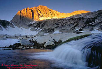 Sunrise light on North Peak over cascade waterfall, Nine Lakes Basin, near Yosemite National Park, California