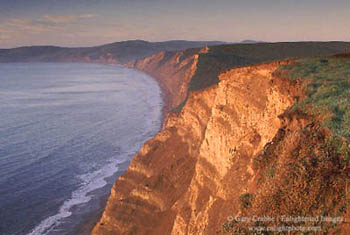 Sunrise light on cliffs above Drakes Bay, Point Reyes National Seashore, Marin County, California