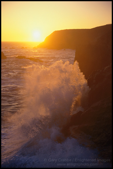 Picture: Wave crashing on coastal rocks at sunset, Marin Headlands, California