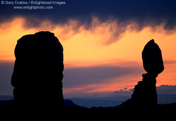 Stormy sunset behind Balanced Rock, Arches National Park, Utah