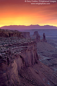 Sunrise light over cliffs near Mesa Arch, Canyonlands National Park, Utah