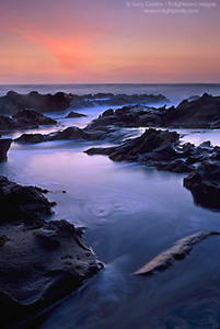 Evening light over coastal rocks at Bean Hollow State Beach, San Mateo County, California