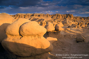 Sunset light durning a storm at Goblin Valley State Park, San Rafael Swell region, Utah