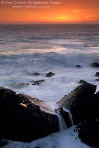 Ocean waves breaking over coastal rocks at sunset, Stillwater Cove Regional Park, Sonoma County Coast, California