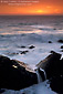 Ocean waves breaking over coastal rocks at sunset, Stillwater Cove Regional Park, Sonoma County Coast, California