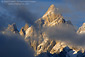 Clouds at sunrise shroud the summit of the Grand Teton, Grand Teton National Park, Wyoming