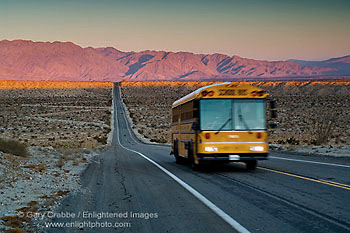 Road to Higher Education school bus on long empty desert road, near Borrego Springs, California