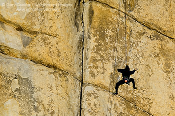 Rock climber climbing at Hidden Valley, Joshua Tree National Park, California2