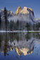 Cathedral Rock reflected in alpine tarn after a winter storm, Yosemite Valley, California