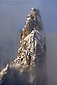 Cathedral Spire in winter clouds, above Yosemite Valley, California