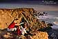 Family watching for migrating whales at sunset from Bodega Head, Sonoma County, California