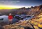 Hiker at sunset from 11,000 foot mountain pass, Hoover Wilderness, near Yosemite National Park, California