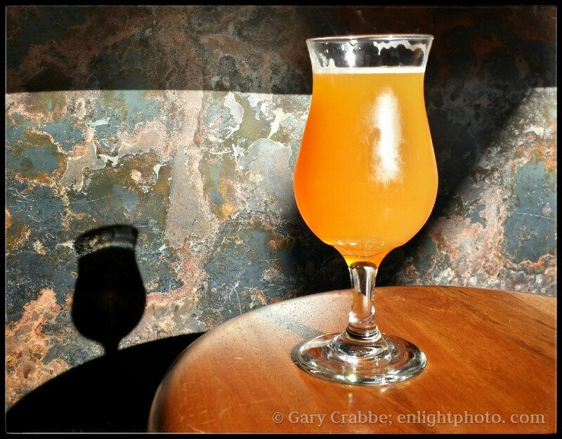 A cold glass of IPA beer sitting in the sunlight at the Hop Grenade, Concord, California