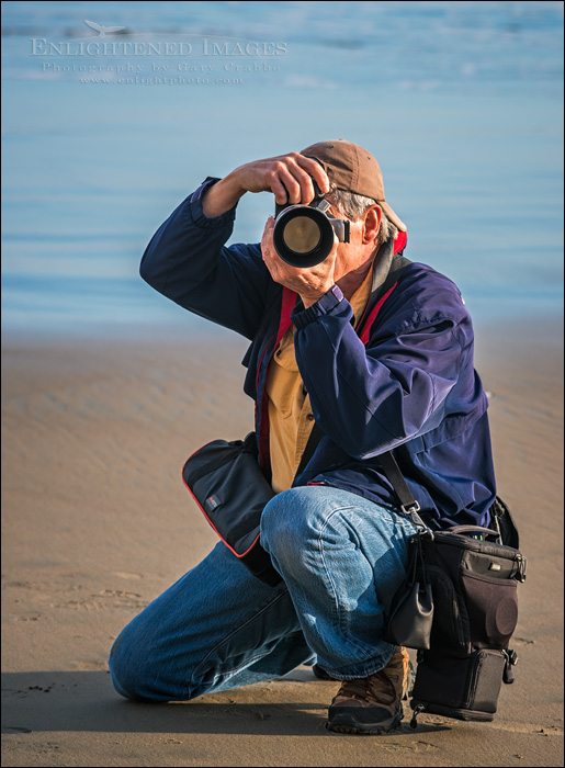 Photographer at work on the beach at Point Reyes National Seashore, Marin County, California