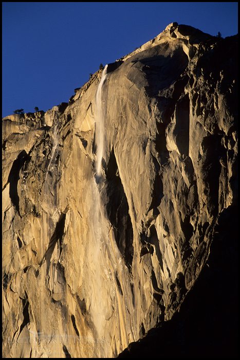 Photo: Sunlight on Horsetail Fall waterfall on the side of El Capitan, Yosemite Valley, Yosemite National Park, California - ID# YES2-0005
