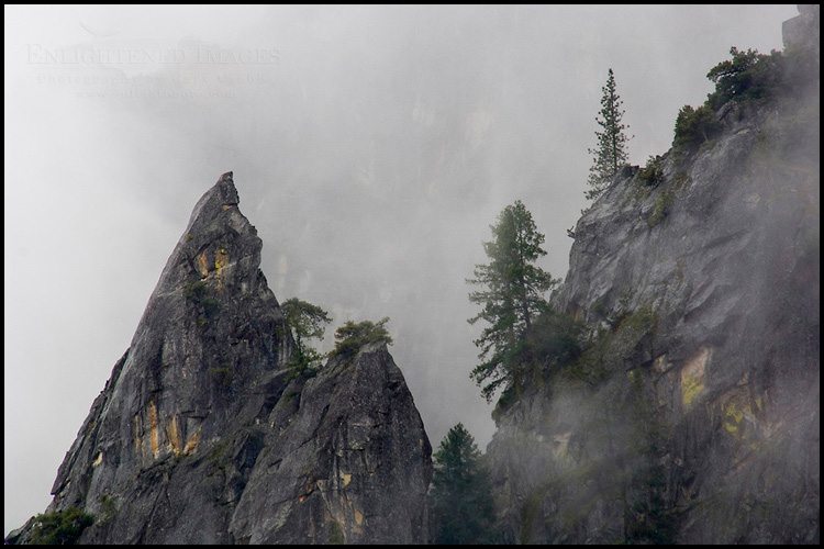 Photo: Sharp jagged pointed rock spire and trees in clouds, Yosemite National Park, California - ID# VLY2-2569