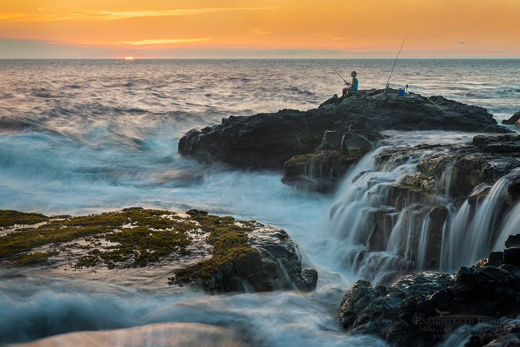 Photo: Young woman fishing off rocks at sunset near Kalihi Point, Kailua-Kona, Big Island of Hawai'i, Hawaii