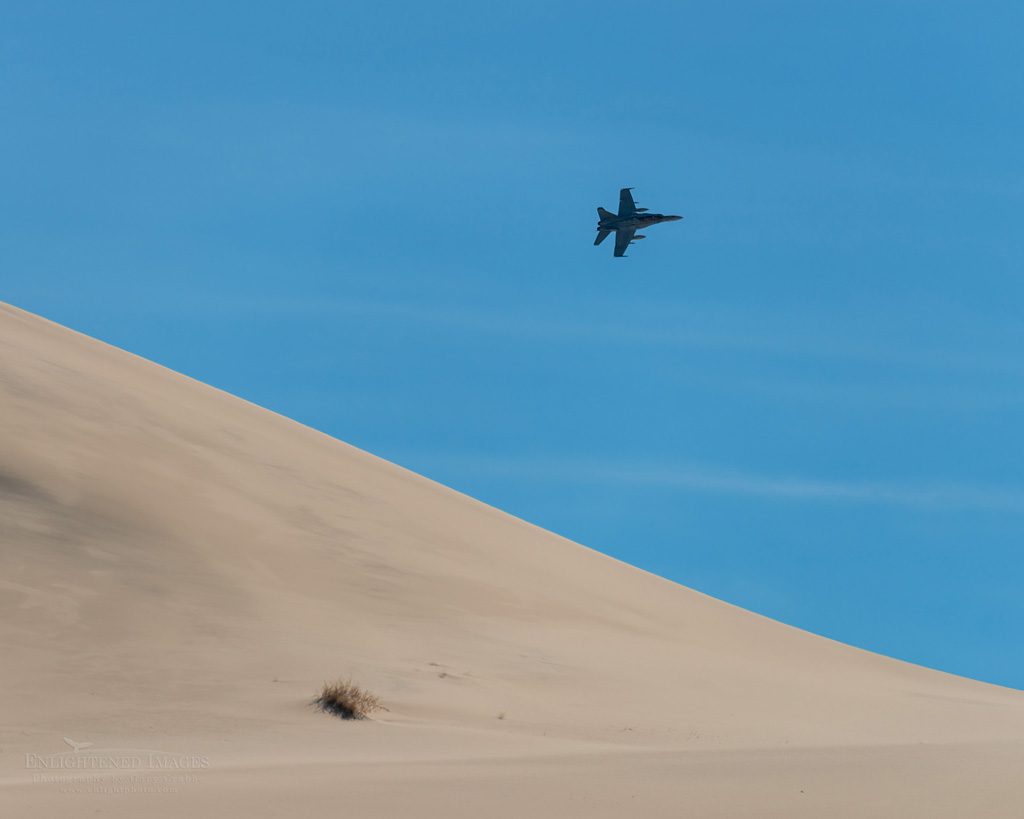 Photo: F-18 Hornet jet flying over Eureka Sand Dunes, Death Valley National Park, California