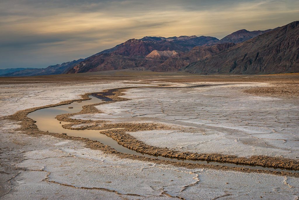 Stream running through the salt flats in the Badwater Playa, Death Valley National Park, California