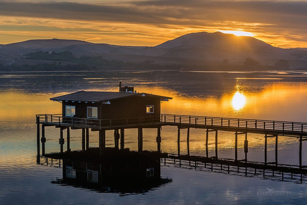 Photo: House on pier sitting above a calm Tomales Bay near Point Reyes at sunrise, Inverness, Marin County, California