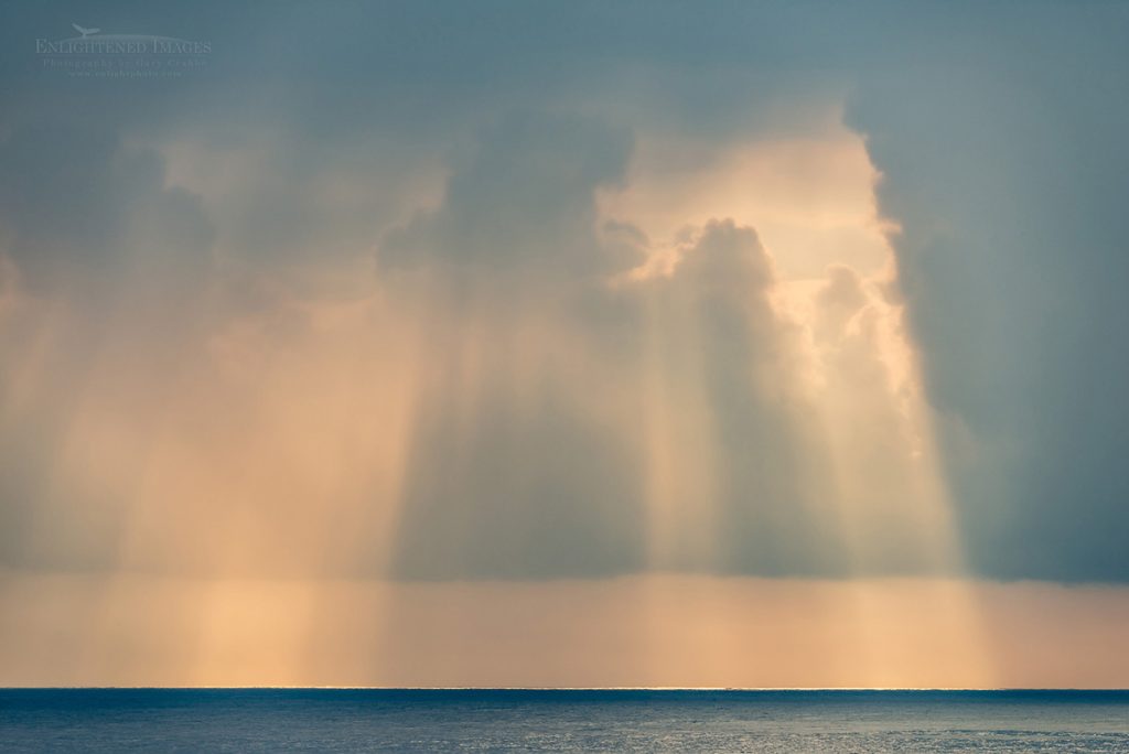 Photo: Sunbeams through dark clouds in the morning over the coast near Lehuawehi Point, South Hilo District, The Big Island of Hawai'i, Hawaii