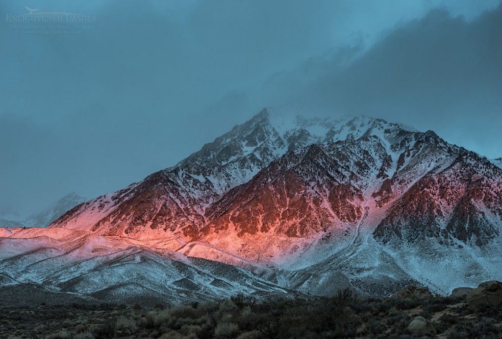 Photo: Alpenglow at sunrise through storm clouds on Mount Tom, Inyo County, Eastern Sierra, California