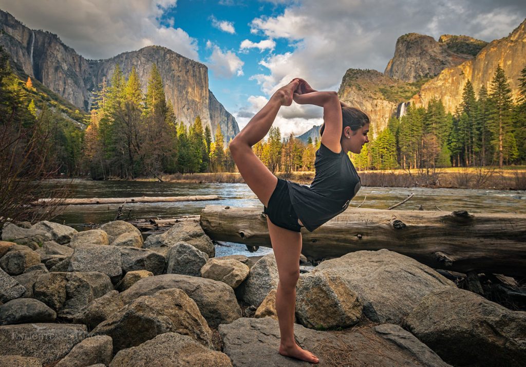 Photo: Young girl doing yoga pose at Gates of the Valley along the Merced River, Yosemite National Park, California