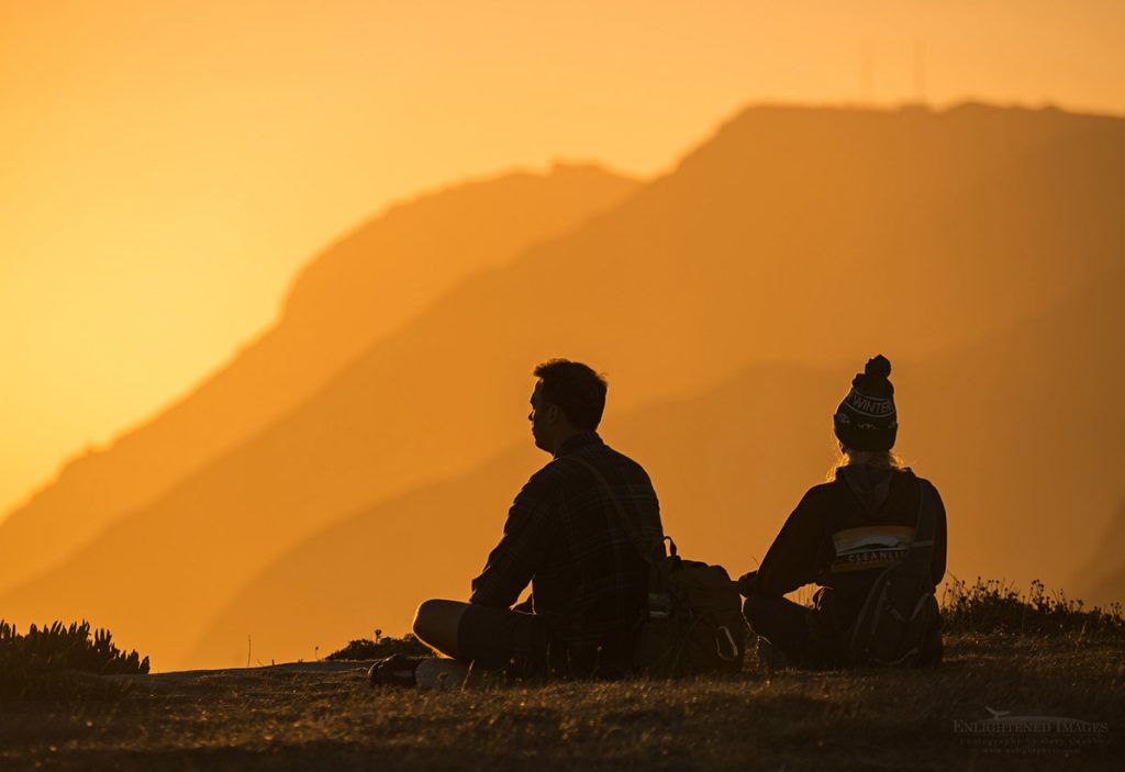 Photo: Couple meditating at sunset at the headlands of Point Reyes National Seashore, Marin County, California