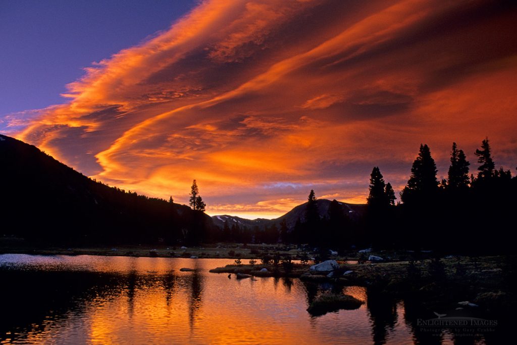 Photo: Lenticular wave cloud at sunset over an alpine tarn at Tioga Pass, Yosemite National Park, California
