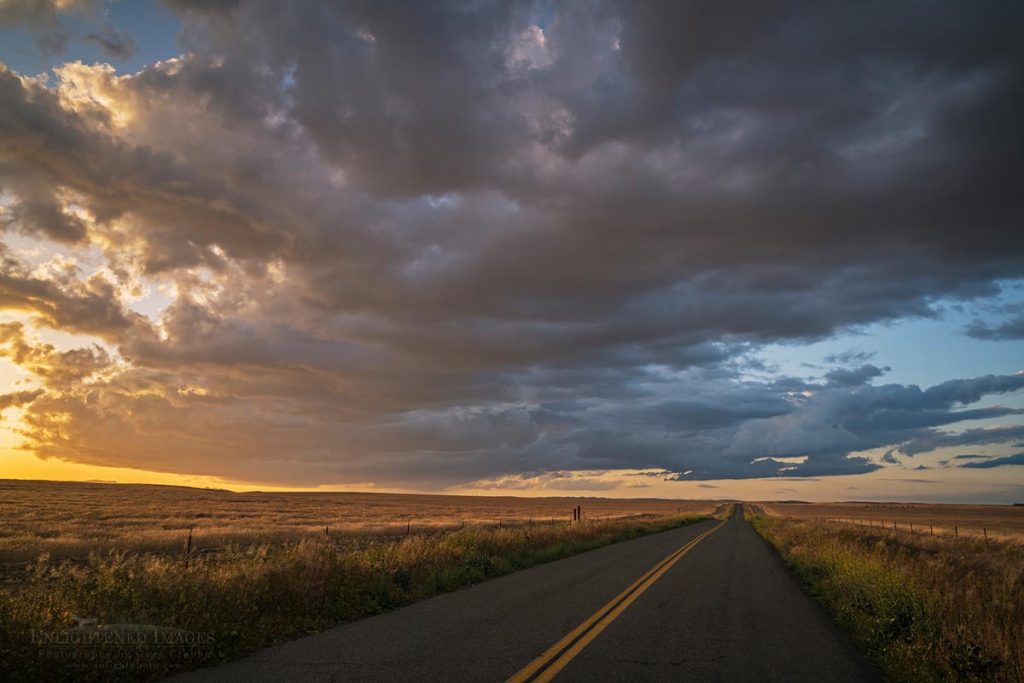 Photo picture of Storm clouds at sunset over lonely empty rural coutry road in the southern Central Valley, Kern County, California