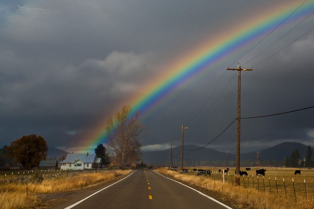 Photo picture of Rainbow over rural country road and farm house in the Hat Creek Valley, Shasta County, California