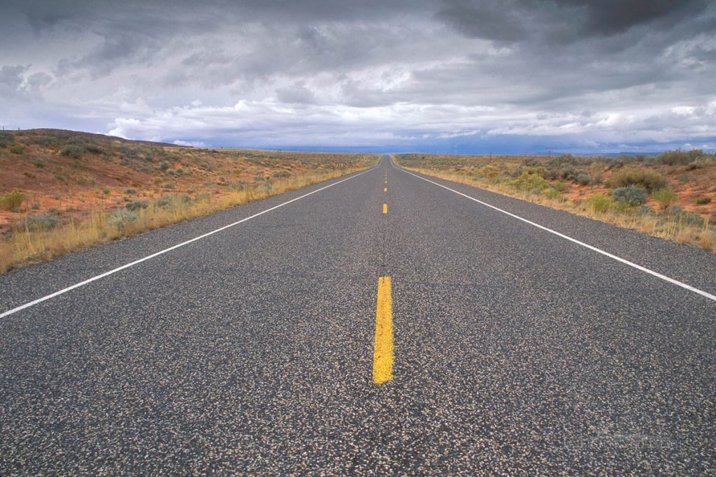 Photo picture of Storm clouds over empty desert highway in southern Utah