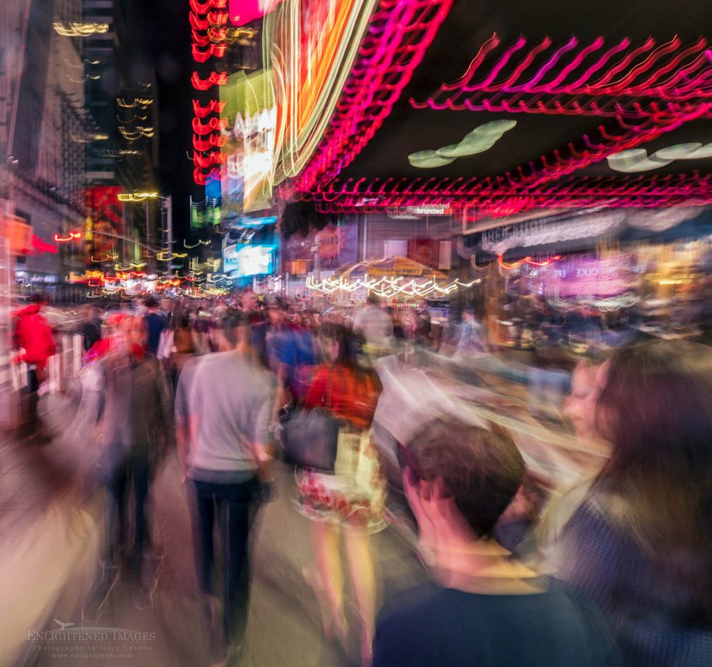 Photo picture of Evening crowds strolling through Times Square, New York City, New York