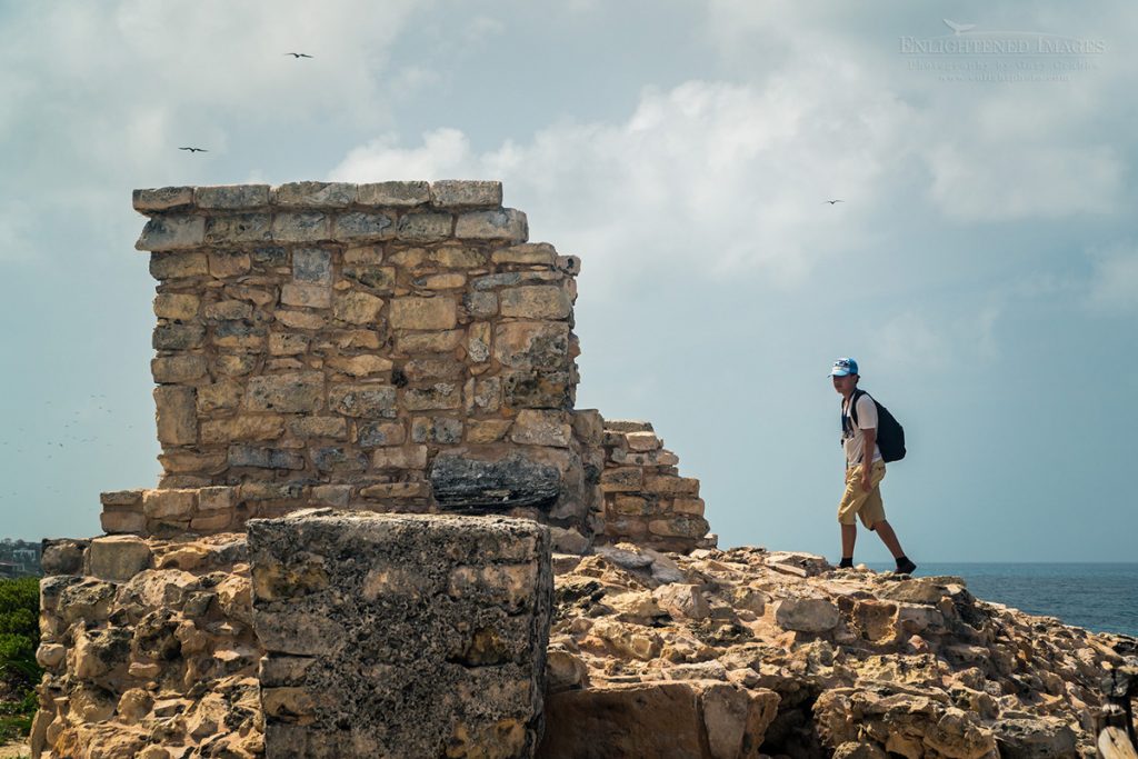 Photo: Tourist on the Mayan ruins of Ixchel Temple at Punta Sur, Isla Mujeres, Yucatan Peninsula, Quintana Roo, Mexico