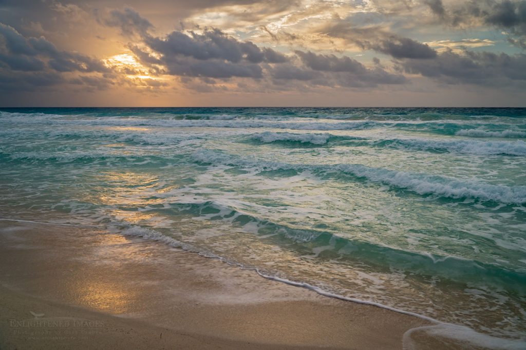 Photo: Waves on beach during a stormy morning sunrise at Playa Delfinas, Cancun, Mexico