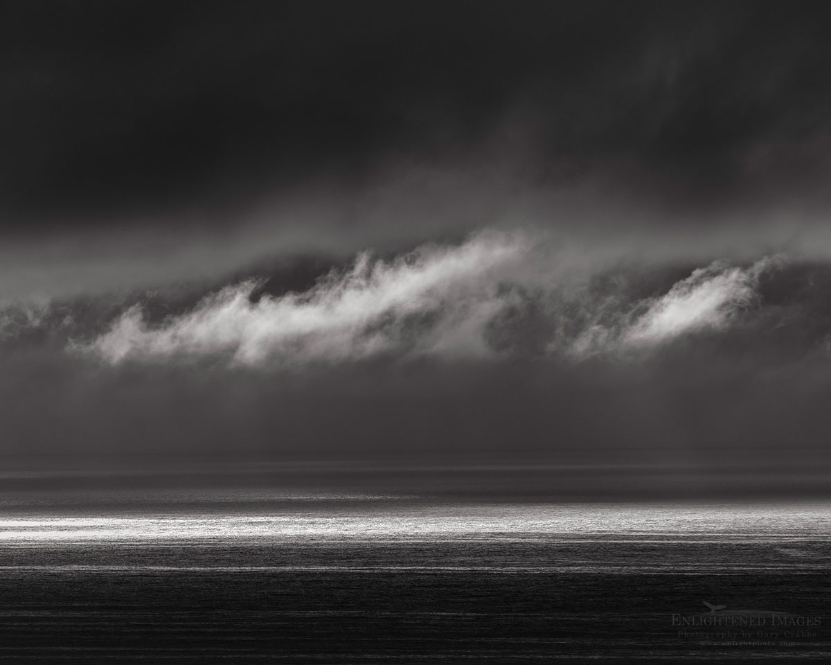 Photo picture of Black and White Storm clouds and sunlight on the Pacific Ocean along the Oregon Coast