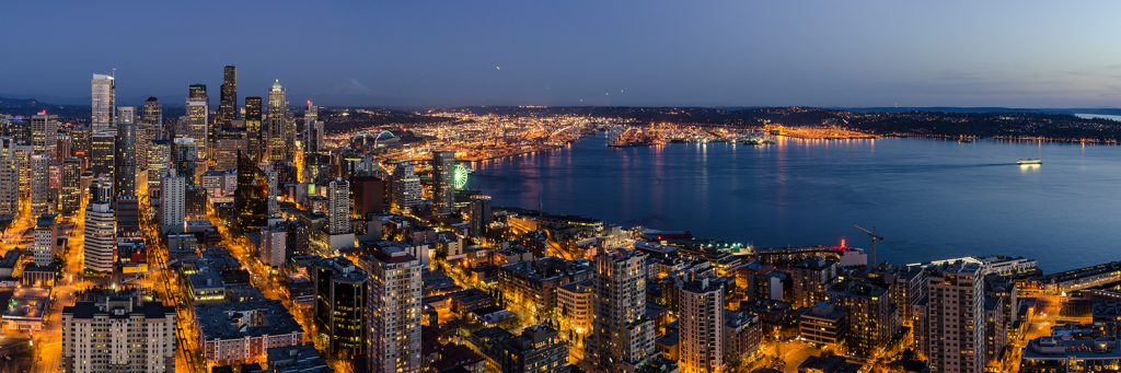 Photo picture of Seattle city skyline in evening with Mount Rainier in distance, Washington